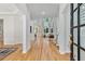Inviting foyer with hardwood floors, leading into the living room with large windows at 3311 Fieldwood Se Dr, Smyrna, GA 30080