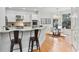 Bright kitchen features white cabinetry, granite countertops, stainless steel appliances, breakfast bar, and a separate eating area at 3311 Fieldwood Se Dr, Smyrna, GA 30080