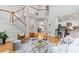 Open-concept living room with hardwood floors, staircase, and modern furniture at 3311 Fieldwood Se Dr, Smyrna, GA 30080