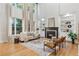 Bright living room with tall windows, fireplace, built-in bookshelves, and neutral decor at 3311 Fieldwood Se Dr, Smyrna, GA 30080