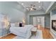 Spacious primary bedroom suite features hardwood floors, a fireplace, and tray ceilings at 3311 Fieldwood Se Dr, Smyrna, GA 30080