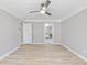 Bedroom showcasing hardwood floors, neutral walls, ceiling fan, and ensuite bathroom at 4833 Glenwhite Dr, Duluth, GA 30096