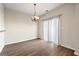 Cozy dining area with laminate flooring, modern lighting, and sliding glass door at 5538 Cascade Sw Rdg, Atlanta, GA 30336