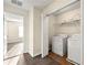 Convenient laundry area with modern washer and dryer units and ample storage space at 5538 Cascade Sw Rdg, Atlanta, GA 30336