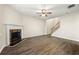 Spacious living room featuring wood floors, a fireplace, ceiling fan, and staircase at 5538 Cascade Sw Rdg, Atlanta, GA 30336