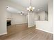 Bright and airy living room with a fireplace, chandelier lighting, and modern wood flooring at 5538 Cascade Sw Rdg, Atlanta, GA 30336