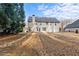 Spacious backyard with mature trees providing shade and privacy to the property at 675 Timber Ives Dr, Dacula, GA 30019