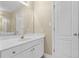 Bright bathroom with white vanity, gold fixtures, and a large mirror at 675 Timber Ives Dr, Dacula, GA 30019