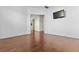 Spacious bedroom with hardwood floors, neutral walls, and natural light from a doorway at 675 Timber Ives Dr, Dacula, GA 30019