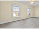 Spacious bedroom with modern flooring, neutral walls and plenty of natural light at 675 Timber Ives Dr, Dacula, GA 30019