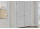 Bedroom closet with white double doors and brass hardware at 675 Timber Ives Dr, Dacula, GA 30019