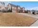 Charming two-story brick home with a well-manicured lawn and attached two-car garage at 675 Timber Ives Dr, Dacula, GA 30019