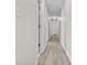 Upstairs hallway with LVP floors, white doors, and access to multiple rooms at 675 Timber Ives Dr, Dacula, GA 30019