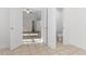 Hallway with tile flooring shows bedroom and half bathroom at 675 Timber Ives Dr, Dacula, GA 30019