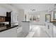 Bright eat-in kitchen featuring an island, stainless appliances, and bright, marble-look flooring at 675 Timber Ives Dr, Dacula, GA 30019
