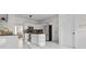 Modern kitchen boasts stainless steel appliances, stylish cabinets, and an island with a countertop at 675 Timber Ives Dr, Dacula, GA 30019