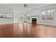 Spacious living room boasts hardwood floors, fireplace, large windows and outdoor access at 675 Timber Ives Dr, Dacula, GA 30019