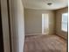 Bedroom featuring neutral colors and a closet at 1986 Villa Spring Ct, Dacula, GA 30019