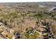 Stunning aerial view showcasing lush landscaping and a winding river, adding natural beauty to this neighborhood at 2115 Azalea Dr, Roswell, GA 30075