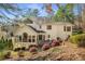 A beautifully landscaped backyard featuring a spacious deck and screened in porch area at 2115 Azalea Dr, Roswell, GA 30075
