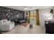 Charming bedroom with designer wallpaper, a crib, and a plush seating area at 2115 Azalea Dr, Roswell, GA 30075