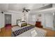 Bright bedroom features a stylish rug, ceiling fan, and plenty of natural light at 2115 Azalea Dr, Roswell, GA 30075
