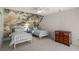 Charming bedroom with twin beds, striking mural wall, and soft, neutral carpeting at 2115 Azalea Dr, Roswell, GA 30075