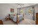 Inviting bedroom featuring a comfortable bed, natural light, and an attractive color scheme at 2115 Azalea Dr, Roswell, GA 30075