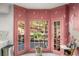 Charming breakfast nook with pastel wall with dragonfly designs and doors leading to the outdoor deck at 2115 Azalea Dr, Roswell, GA 30075