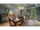 Sophisticated dining room with wainscotting, statement chandelier, and ample seating for elegant gatherings at 2115 Azalea Dr, Roswell, GA 30075