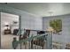 Upstairs hallway with decorative wallpaper, bright lighting, and an open view of the bedroom at 2115 Azalea Dr, Roswell, GA 30075