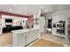 Open-concept kitchen featuring a central island and seamless flow into the living area with a fireplace at 2115 Azalea Dr, Roswell, GA 30075
