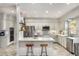 Bright, updated kitchen with white cabinets, stainless steel appliances, a central island, and stylish backsplash at 2115 Azalea Dr, Roswell, GA 30075