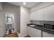 Practical kitchenette with modern microwave, sleek countertops, and mini fridge with storage at 2115 Azalea Dr, Roswell, GA 30075