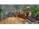 Cozy living room with hardwood floors, large windows, and stylish decor for a warm, inviting atmosphere at 2115 Azalea Dr, Roswell, GA 30075