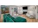 Bright and airy living room with fireplace, white sofas, and green sectional, offering a cozy and inviting atmosphere at 2115 Azalea Dr, Roswell, GA 30075