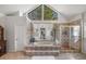 Luxurious bathroom featuring an oversized tub, glass enclosed shower, and a large window with natural light at 2115 Azalea Dr, Roswell, GA 30075