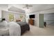 Calming main bedroom with a sitting area, television, light walls, and plenty of natural light at 2115 Azalea Dr, Roswell, GA 30075