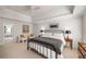 Spacious main bedroom with a neutral color palette, accent chairs, and an ensuite bathroom entrance at 2115 Azalea Dr, Roswell, GA 30075