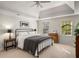 Bright main bedroom featuring a tray ceiling, neutral walls, and large windows providing natural light at 2115 Azalea Dr, Roswell, GA 30075