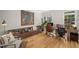 Bright home office with hardwood floors, custom bookshelves, large windows, and space for multiple workstations at 2115 Azalea Dr, Roswell, GA 30075
