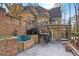 Stunning brick home exterior featuring wrought iron accents, balcony, and water feature at 9185 Old Southwick Pass, Johns Creek, GA 30022