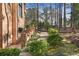Charming walkway leading to fenced-in backyard with mature landscaping at 9185 Old Southwick Pass, Johns Creek, GA 30022