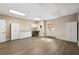 Spacious room with white cabinets, countertops, and a double door leading outside at 9185 Old Southwick Pass, Johns Creek, GA 30022