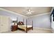 Serene bedroom with a four-poster bed, soft lighting, and neutral color palette at 9185 Old Southwick Pass, Johns Creek, GA 30022