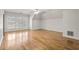 Spacious bedroom with hardwood floors, white trim, vaulted ceiling, and plenty of natural light at 9185 Old Southwick Pass, Johns Creek, GA 30022