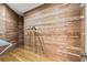 Walk-in closet with cedar plank walls, hardwood floors, and wire shelving for ample storage space at 9185 Old Southwick Pass, Johns Creek, GA 30022