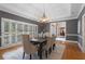 Elegant dining room with hardwood floors and an open view to the foyer at 9185 Old Southwick Pass, Johns Creek, GA 30022