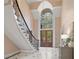 Elegant foyer showcasing a soaring ceiling, grand staircase, and marble flooring at 9185 Old Southwick Pass, Johns Creek, GA 30022