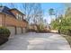 Spacious three car garage and basketball court in a large private driveway at 9185 Old Southwick Pass, Johns Creek, GA 30022